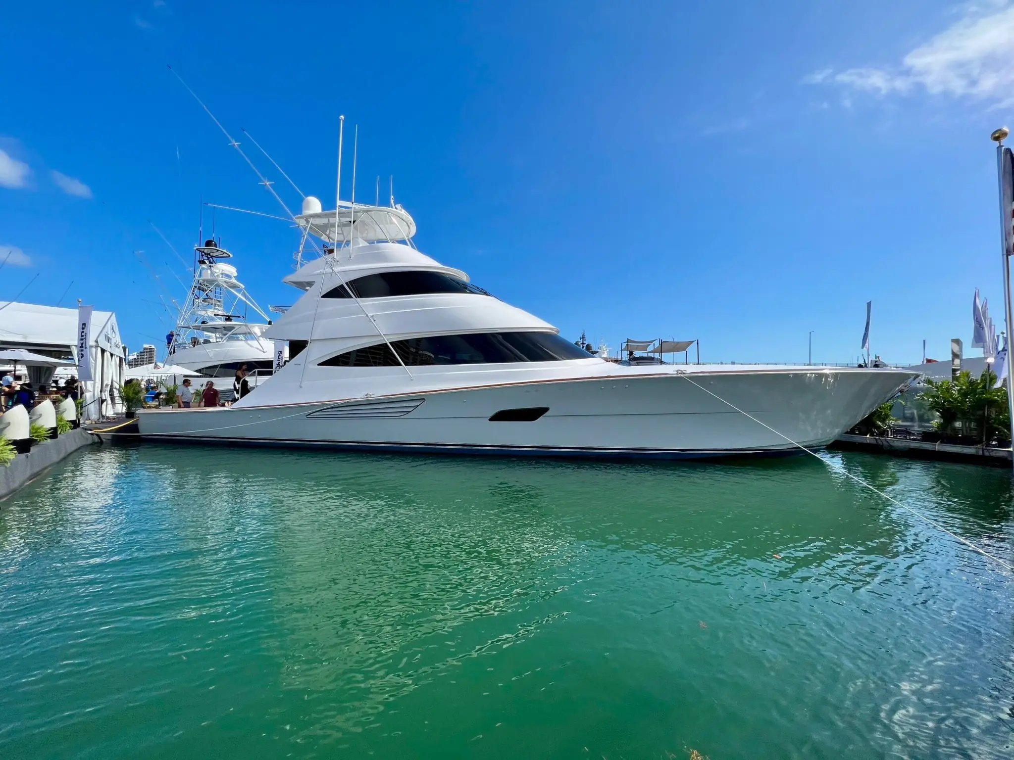 Large Viking sportfishing yacht docked at a marina